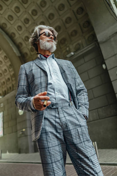 istock Handsome senior man standing on the street 1171393339