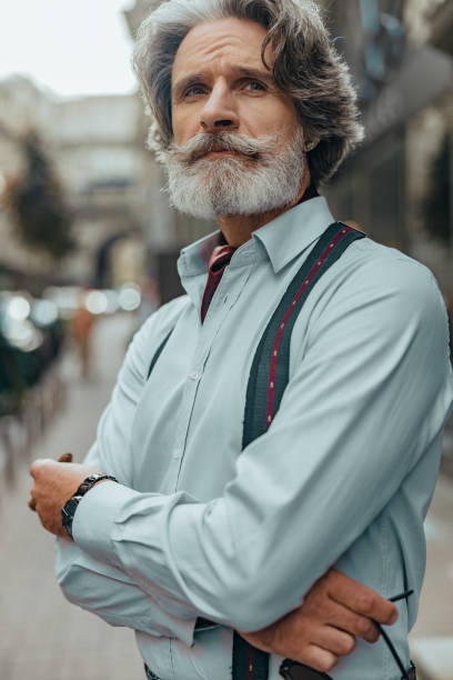 istock Handsome elegant gentleman standing on the street 1171393455