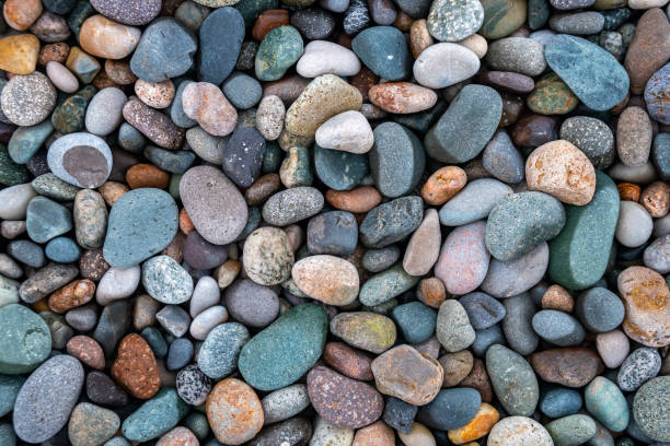 istock Close up of rounded and polished beach rocks. 1171395162
