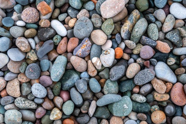 istock Close up of rounded and polished beach rocks. 1171395167