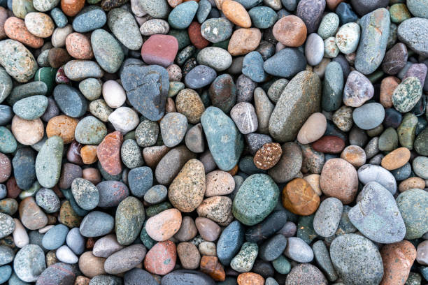 istock Close up of rounded and polished beach rocks. 1171395169