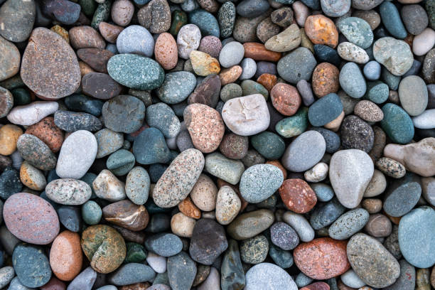 istock Close up of rounded and polished beach rocks. 1171395174