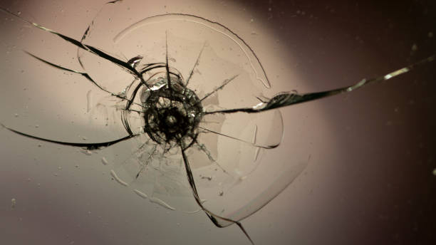 istock Holes and cracks on the glass On defocused background 1171395260