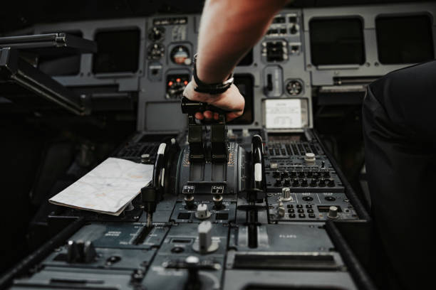 istock Male arm accelerating on throttle in cockpit of aiplane 1171402177
