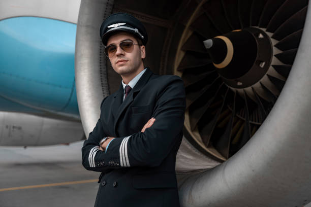 istock Handsome young man standing near engine of airplane 1171402289