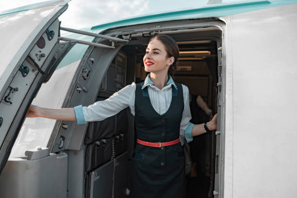 istock Attractive female flight attendant is on duty on board 1171404348