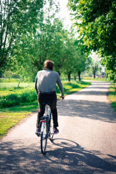 istock Active Senior Male Cyclist on Country Lane in Springtime 1171405431