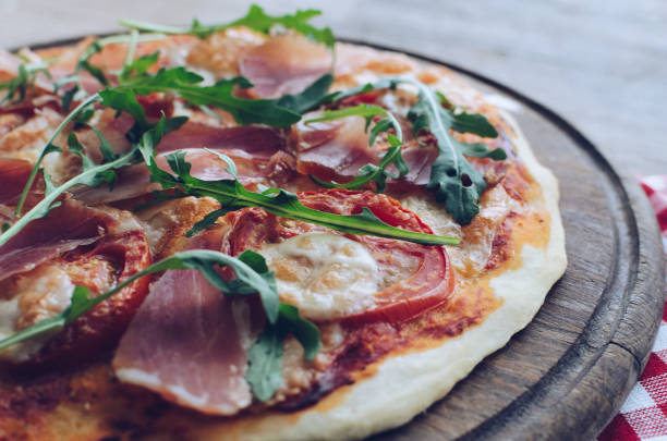 istock Italian pizza with prosciutto and arugula 1171414999
