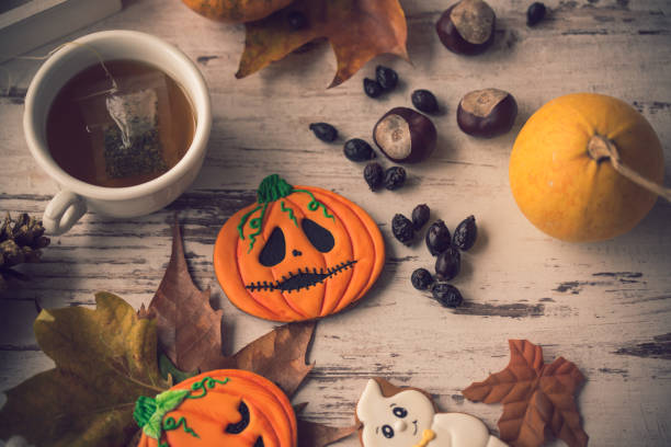 istock Hot tea and Halloween cookies and decorations 1171415100