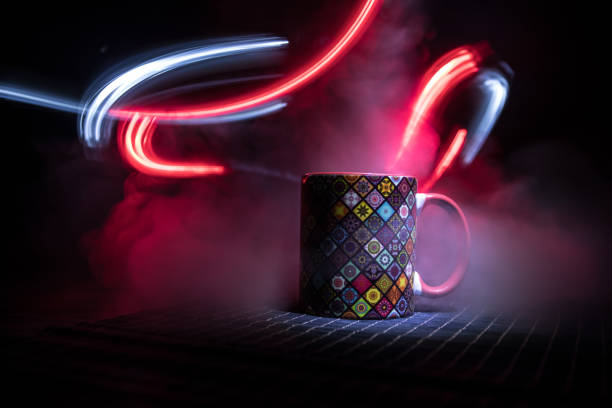 istock Beautiful eastern style textured ceramic cup of coffee (or tea) with smoke over dark toned background. 1171418199
