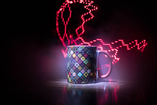 istock Beautiful eastern style textured ceramic cup of coffee (or tea) with smoke over dark toned background. 1171418200
