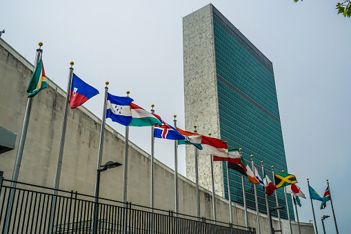 Waving flags in blue sky