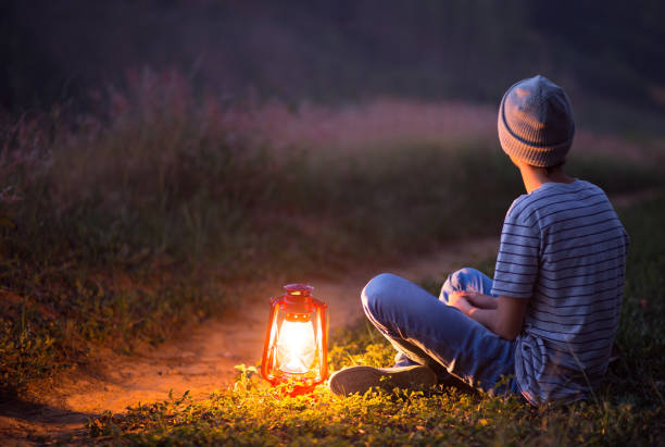 istock young boy sitting contemplating the nithfall 1171422568