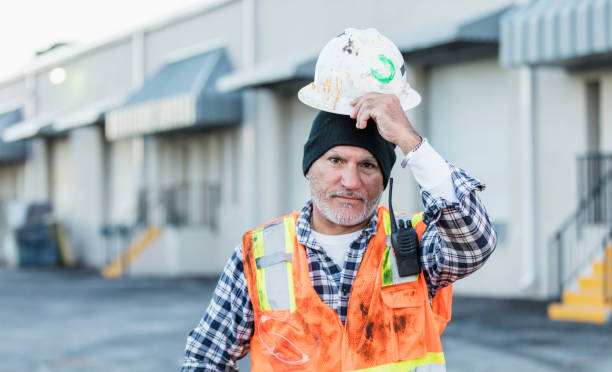 istock Hispanic worker outside with hardhat and safety vest 1171424672