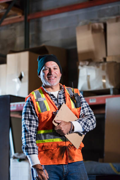 istock Hispanic man in warehouse taking inventory 1171425492