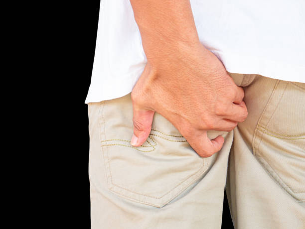 istock Young Man Has Itching In The Anus, Anal Disorders.  isolated on black background, Clipping path. 1171425565
