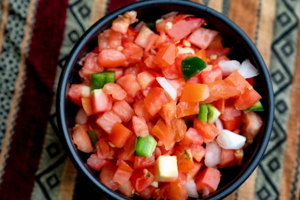 istock A Brightly Colored Bowl Of Pico de Gallo On A Mexican Patterned Background 1171425878