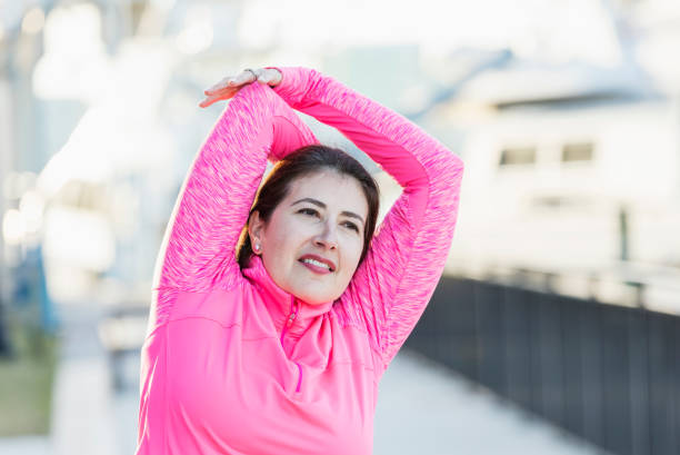 istock Mature Hispanic woman stretching 1171430082