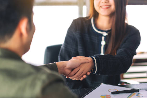 istock two businesspeople shaking hands in a meeting 1171430384