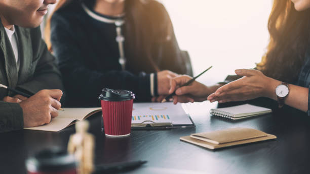 istock businessman working and discussing about business data together in office 1171430434