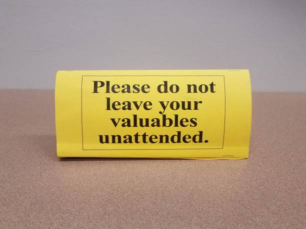 istock yellow please do not leave your valuables unattended sign on table 1171431116
