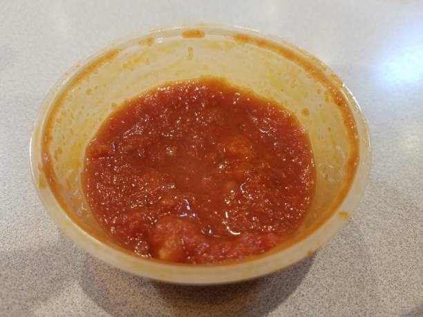 istock small plastic cup of red tomato sauce 1171433215
