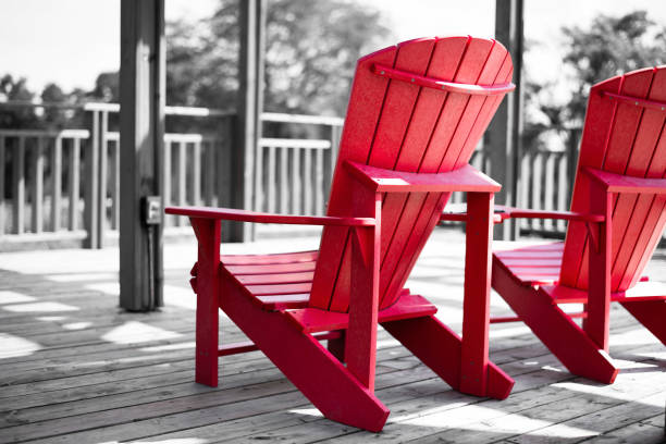 A pair of red chairs with a black and white theme