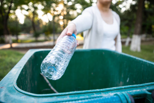 istock Throw the plastic bottle into the trash can 1171440622