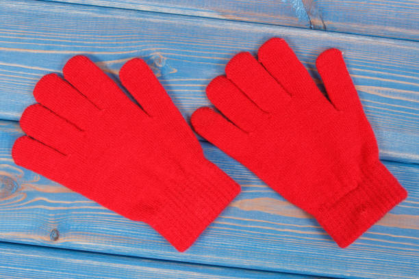 pair of red womanly gloves for autumn or winter - womanly imagens e fotografias de stock