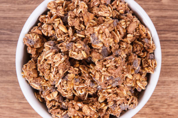 Oat flakes with chocolate as source iron and fiber, healthy snack concept stock photo