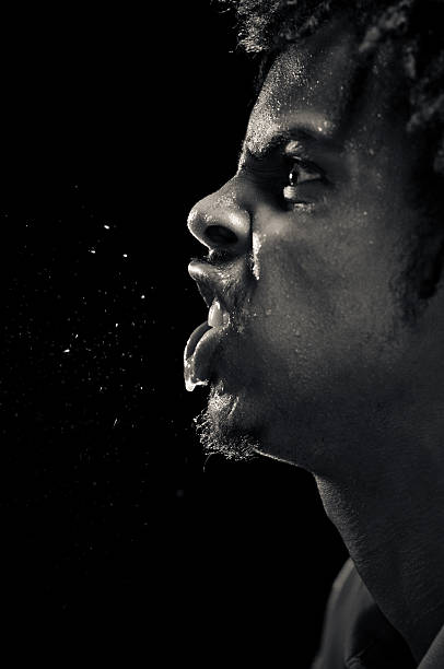 Young African American man spitting while rhyming stock photo