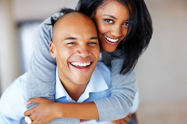 istock Young couple enjoying piggyback ride 117144444