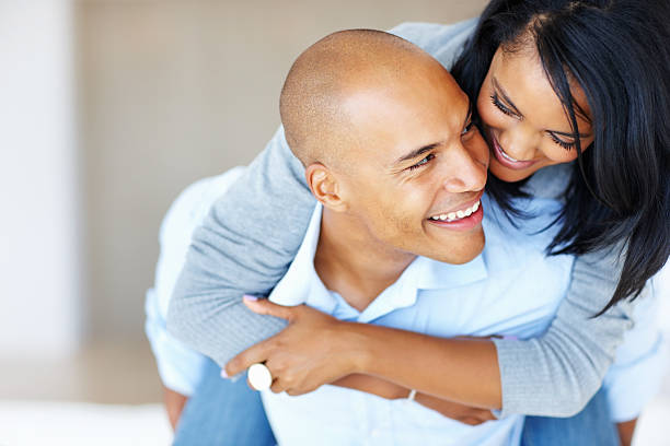 istock Happy couple enjoying piggyback ride 117144447