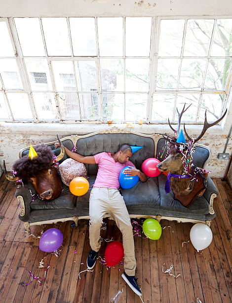 Party Animals Passed Out On Couch After A Big Night Stock Photo - Download  Image Now - iStock