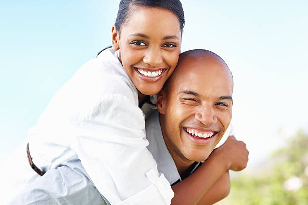 istock Happy, playful couple in park 117144516