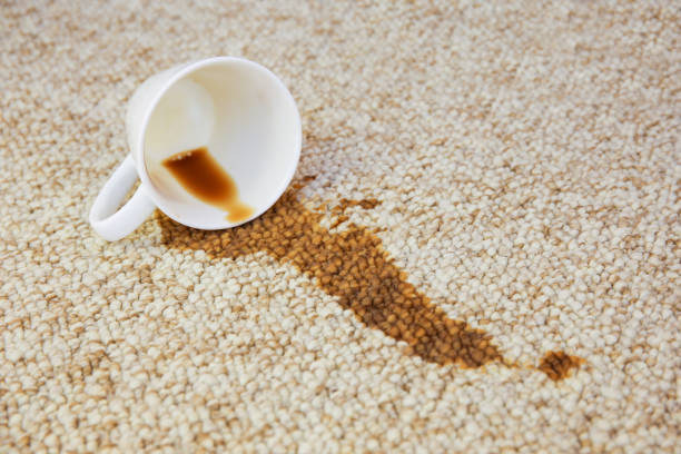 istock Cup of coffee fell on carpet. Stain is on floor. 1171445437