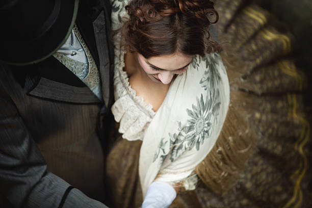 Victorian romantic couple whirls while dancing together. Victorian romantic couple whirls while dancing together.  period costume stock pictures, royalty-free photos & images