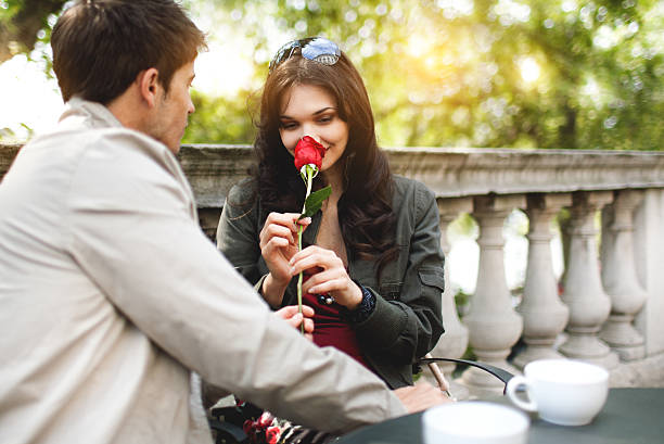 istock Young romantic couple on a date in cafe outdoor. 117144572