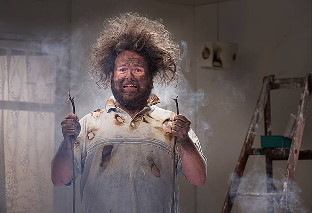 DIY disaster man gets a shock with his home improvements careless stock pictures, royalty-free photos & images