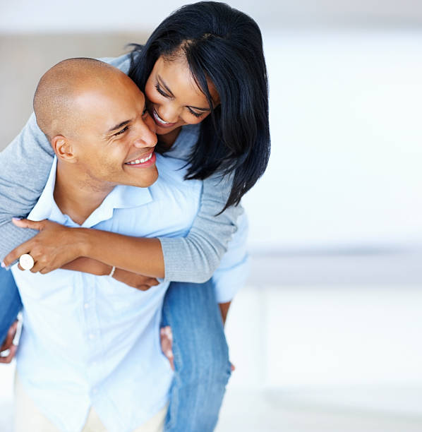 istock Attractive couple enjoying piggyback ride 117144620