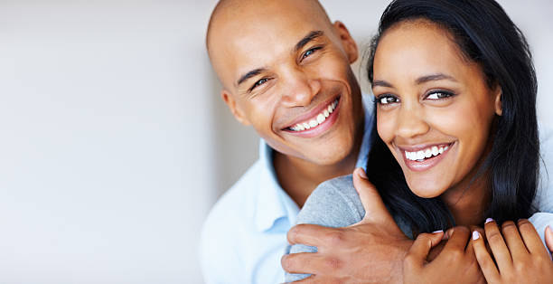 istock Smiling woman being embraced by her boyfriend 117144623