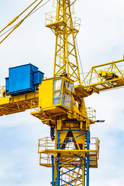 istock Yellow construction crane against the sky. 1171447263
