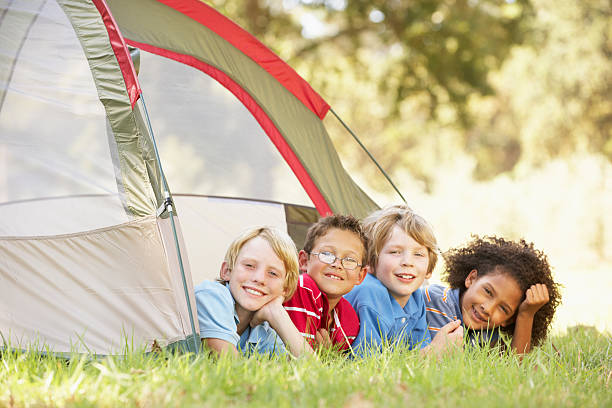 Two brothers in a tent. Hiking and exploring the forest.