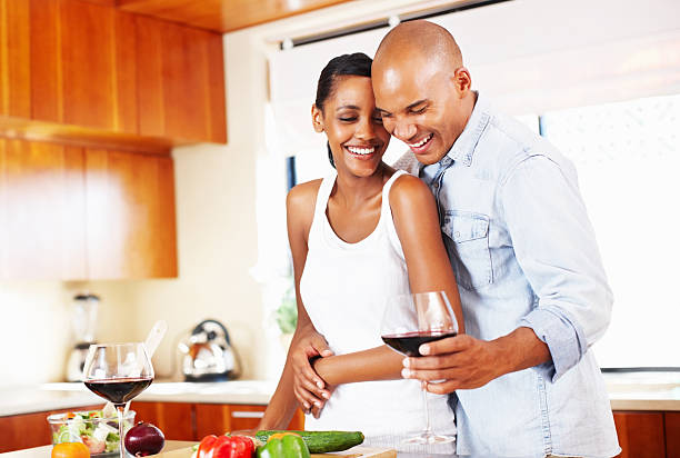 istock Couple celebrating in the kitchen 117144846