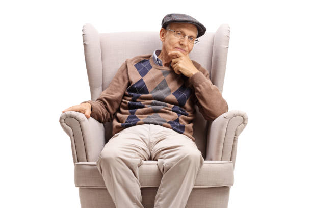 istock Elderly man sitting in an armchair and thinking 1171449475