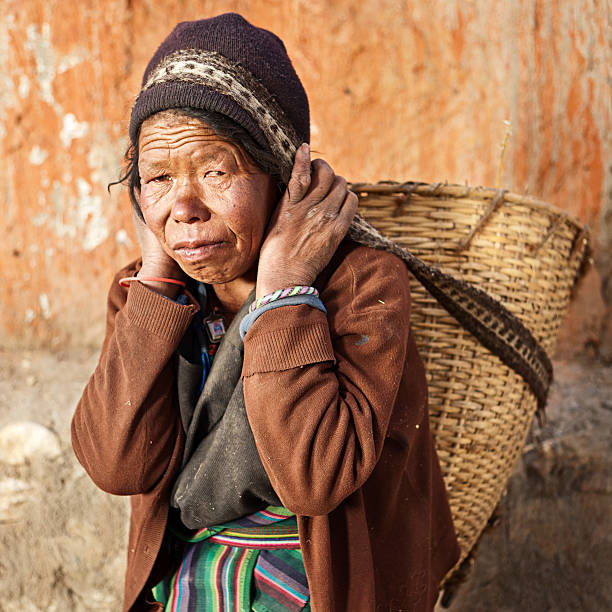 istock Nepali woman carrying basket 117145013