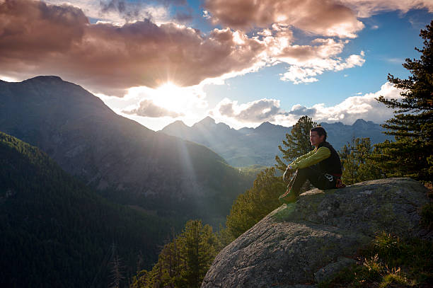 istock Man at mountain sunrise 117145020