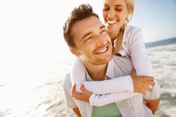 istock Couple having fun on the beach 117145155
