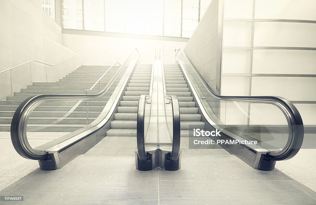 Escalator in the sun Escalator in a station.  Escalator Stock Photo