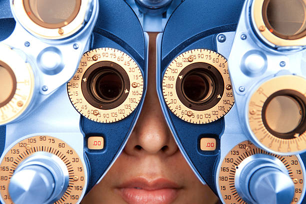 close up horizontal of optometry machine blue and orange stock photo